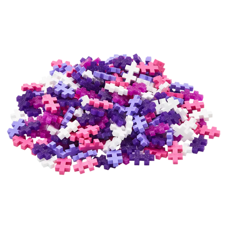 A pile of colorful interlocking puzzle pieces is displayed against a white background. The pieces are pink, purple, and white, creating a playful and vibrant tone.