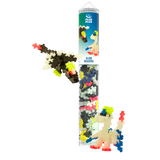 Tube of colorful building blocks labeled "Glow Dragons" with small dragon figures built from the pieces. The blocks are colorful and playful.