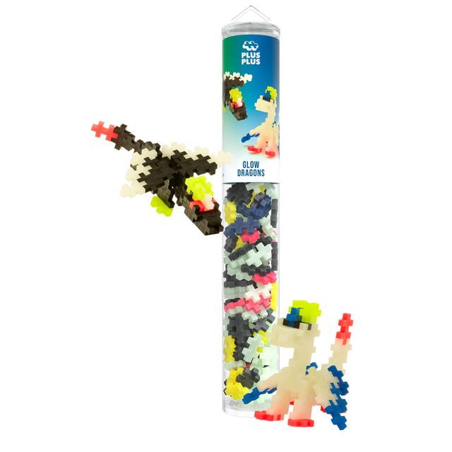 Tube of colorful building blocks labeled "Glow Dragons" with small dragon figures built from the pieces. The blocks are colorful and playful.