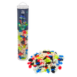 Tube of Plus-Plus Glow puzzle pieces with colorful interlocking pieces piled next to it. Packaging displays glowing mushrooms, creating a playful tone.