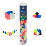 Transparent tube with colorful, interlocking plastic pieces labeled "Plus Plus Glow" against a white background. Shapes include a cube and a zigzag.