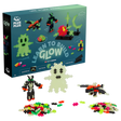 Toy set box with "Learn to Build Glow" kit. Includes 160 bright, glowing pieces forming figures like a ghost and alien, against a white background.