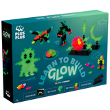 Glow block set packaging featuring colorful, glowing block models like a creature, figure, and structures; labeled "Learn to Build Glow." Made in Denmark.