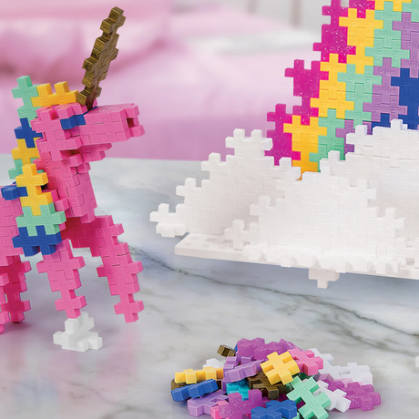 Colorful Plus-Plus unicorn build with rainbow and clouds, highlighting creative STEAM building blocks for kids.