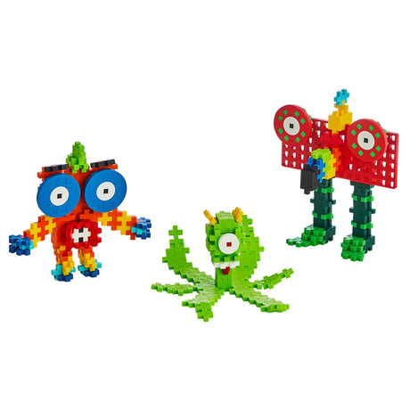 Colorful Plus-Plus Learn to Build Creatures featuring a red monster, green octopus, and tall robot made of building blocks.