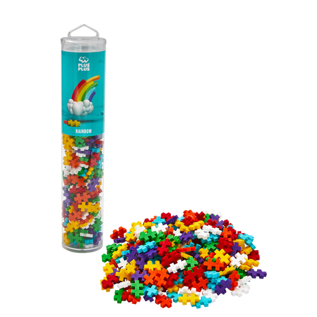 A cylindrical container filled with colorful interlocking puzzle pieces labeled "Rainbow." Pieces are spilled in front, against a white background.