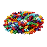 A pile of colorful interlocking plastic pieces in various shapes and bright colors, such as red, blue, green, and yellow, set against a white background.