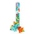 A tube of colorful interlocking puzzle pieces labeled "Rainbow Unicorns." Two unicorn figures, one blue and one orange, are built from the pieces.