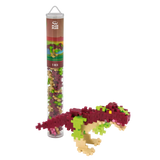 Building set package containing small, interlocking pieces next to a T-Rex dinosaur model made of pink, green, and beige pieces, against white background.