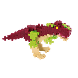 Colorful dinosaur model built from interlocking plastic pieces. The dinosaur features red, green, and beige colors, set against a white background.
