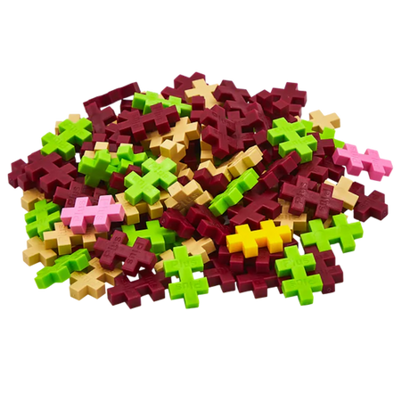 A pile of colorful interlocking plastic pieces shaped like simple geometric plus signs. Colors include green, red, pink, beige, and yellow on a white background.