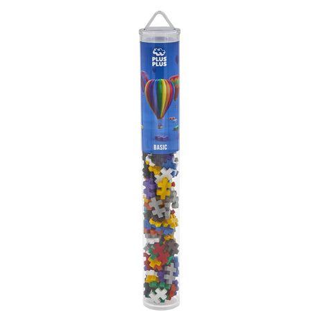Plus-Plus Basic building blocks in a clear travel tube with a hot air balloon design on the blue label.
