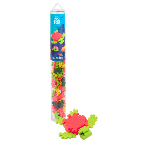 Plus-Plus Sea Turtle building tube with 100 colorful pieces and a completed toy turtle model. Educational STEM toy set.