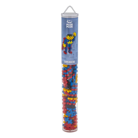 Plus-Plus Superhero building set tube containing 100 red, blue, yellow, and black interlocking construction pieces.