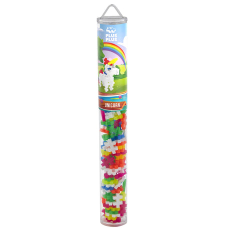Plus-Plus Unicorn building set in a clear travel tube with colorful interlocking pieces and rainbow packaging.