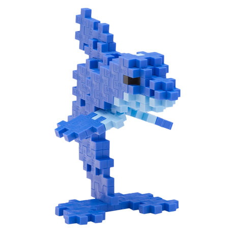Blue dolphin figurine built with Plus-Plus interlocking blocks, jumping on a blue base.