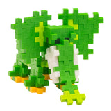 Green and white elephant figure built from Plus-Plus interlocking blocks on a white background.