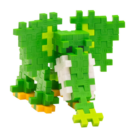 Green and white elephant figure built from Plus-Plus interlocking blocks on a white background.