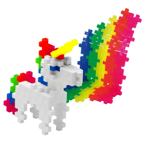 White unicorn 3D figure with a yellow horn and rainbow tail, made from colorful Plus-Plus interlocking building blocks.