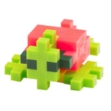 Colorful sea turtle toy built with lime green, pink, and dark green Plus-Plus interlocking construction pieces.