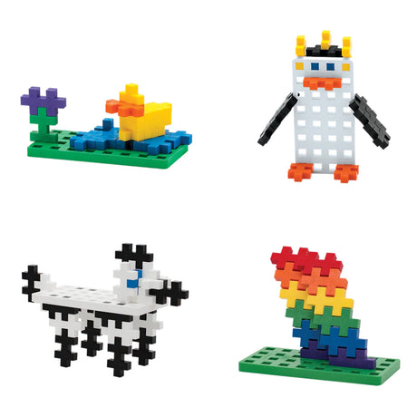 Four Plus-Plus block creations: a duck on a pond, a penguin, a spotted dog, and a rainbow stack on green baseplates.