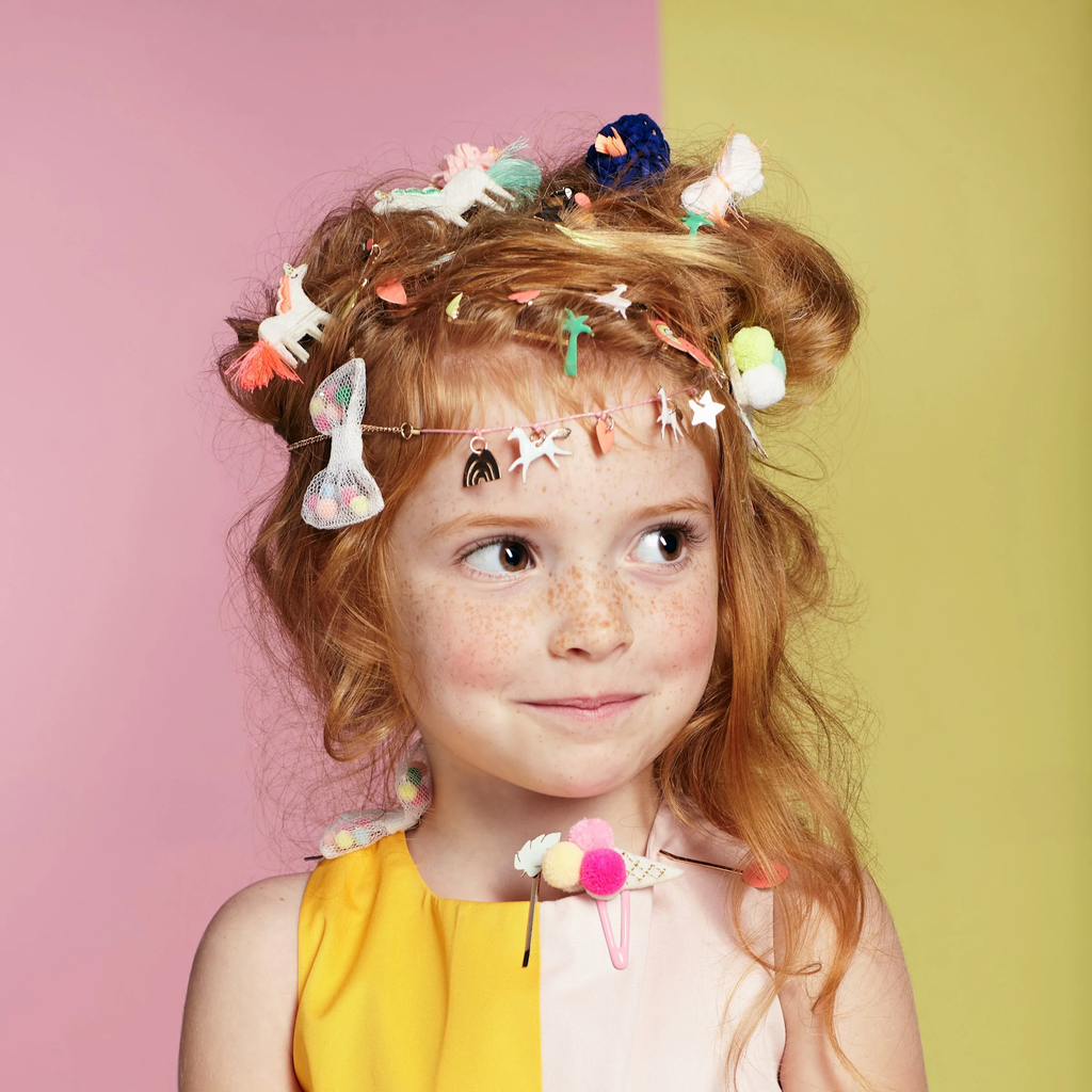 Featuring fun ice cream cone shapes with colourful pom pom tops, adding a cute and whimsical flair to kids' hairstyles.