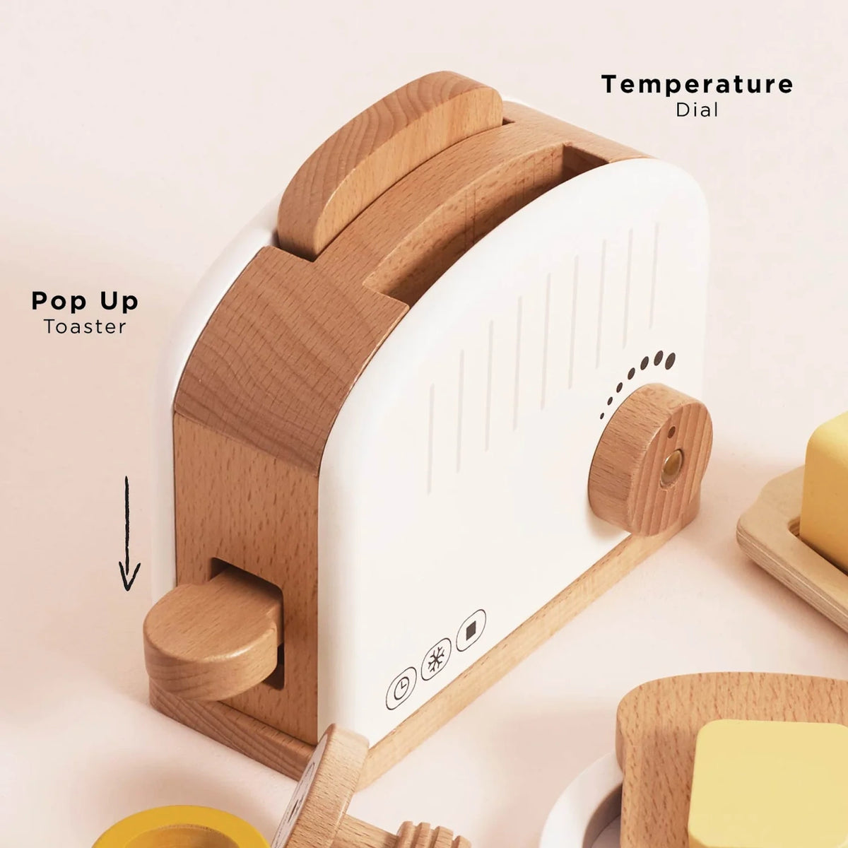 Wooden toy pop-up toaster with temperature dial and lever mechanism.