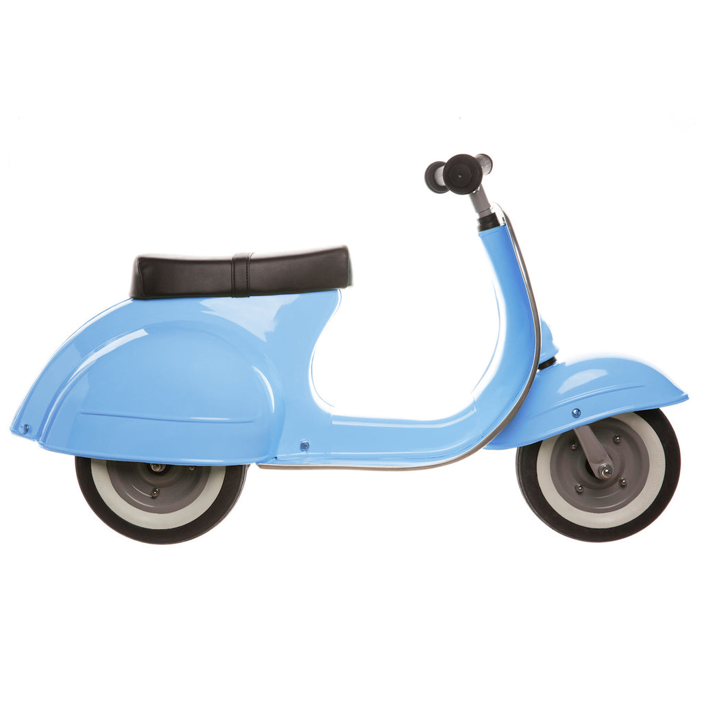 A light blue vintage-style toy scooter with a black seat, simple handlebar, and grey wheels. The design is sleek and playful, evoking a retro charm.