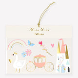 Meri Meri princess-themed temporary tattoos package with a swan, rainbow, carriage, castle, and gold string.