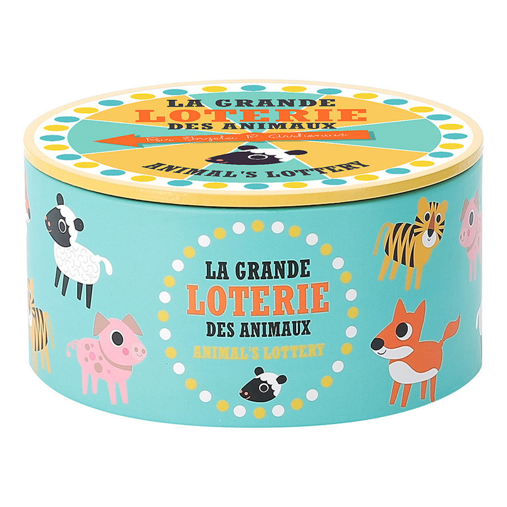 Round turquoise box labeled "La Grande Loterie des Animaux" with playful animal illustrations, including a sheep, tiger, and fox, conveying a whimsical tone.