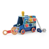 Wooden blue handyman activity truck toy by Moulin Roty with colorful bolts, a wrench, a screwdriver, and a ladder.