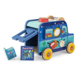 A wooden blue toy activity van with spinning wheels, a lift-up back door, and small play accessories.