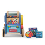 Moulin Roty wooden activity car with colorful beads, character illustrations, and matching toy accessories.