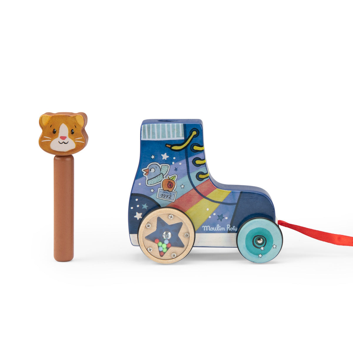 A blue wooden roller skate toy next to a removable cat-head peg, featuring colorful graphics and a red pull ribbon.