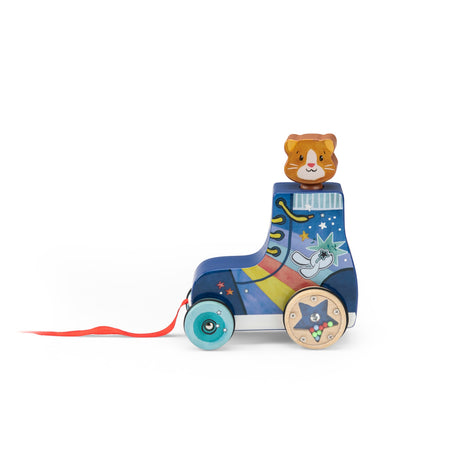 Wooden pull-along toy shaped like a blue roller skate with a cat head, rainbow design, and a red string on a white background.