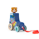 Wooden pull-along roller skate toy featuring a cat head, colorful graphics, and a red ribbon on a white background.
