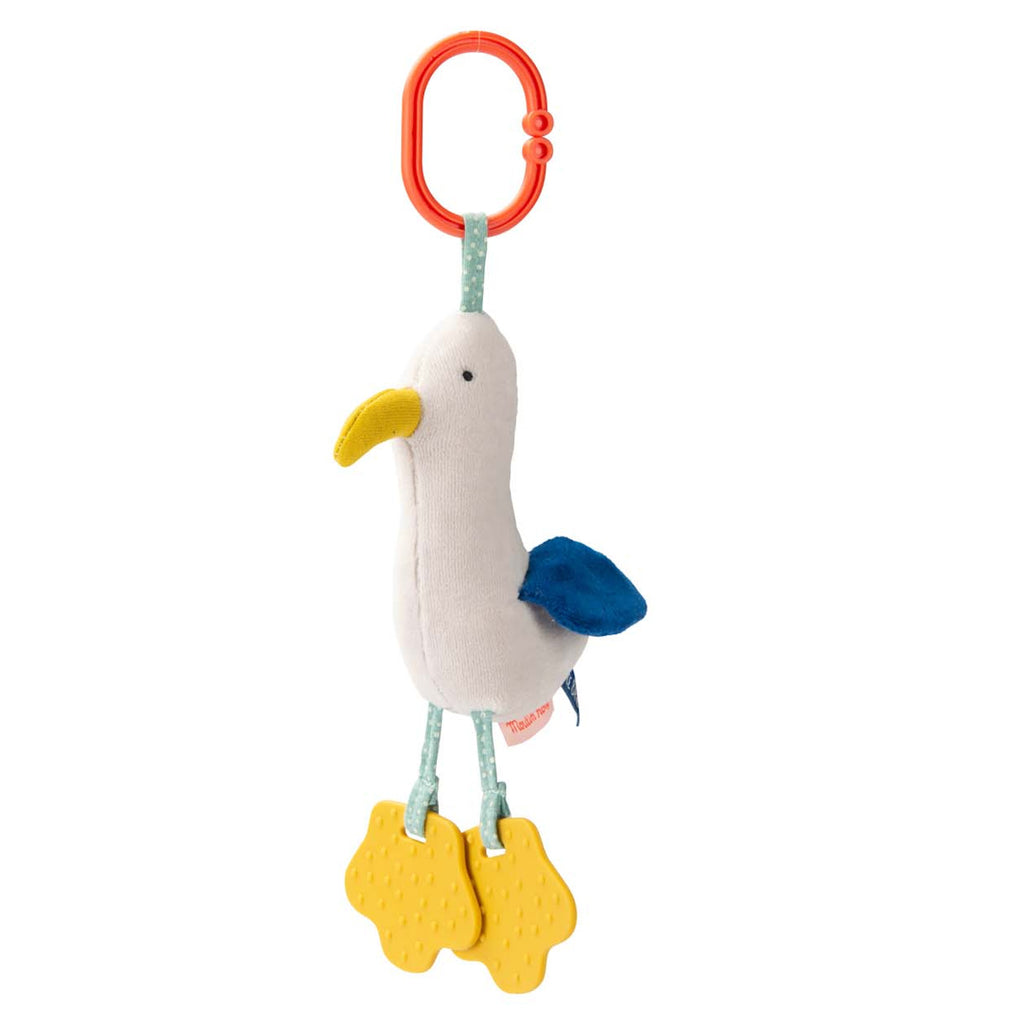 Plush seagull toy with a yellow beak, blue wings, and textured yellow feet. It hangs from a red clip, conveying a playful and cheerful tone.