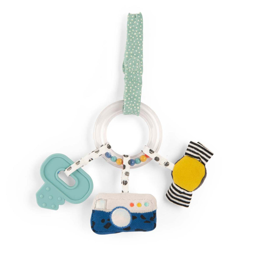 Baby toy with a teal polka dot strap, featuring a clear ring with colorful beads, a blue teether, a plush camera, and a striped yellow rattle.