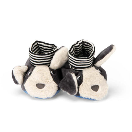 Plush dog baby slippers with black and white striped ankle cuffs on a white background.