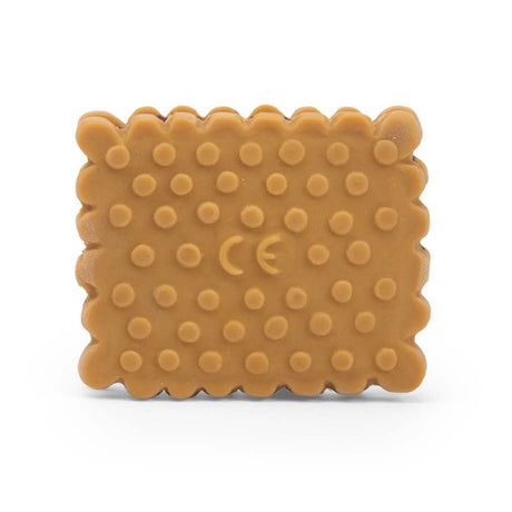 Biscuit shaped silicone baby teething toy in a light brown color with a textured surface.