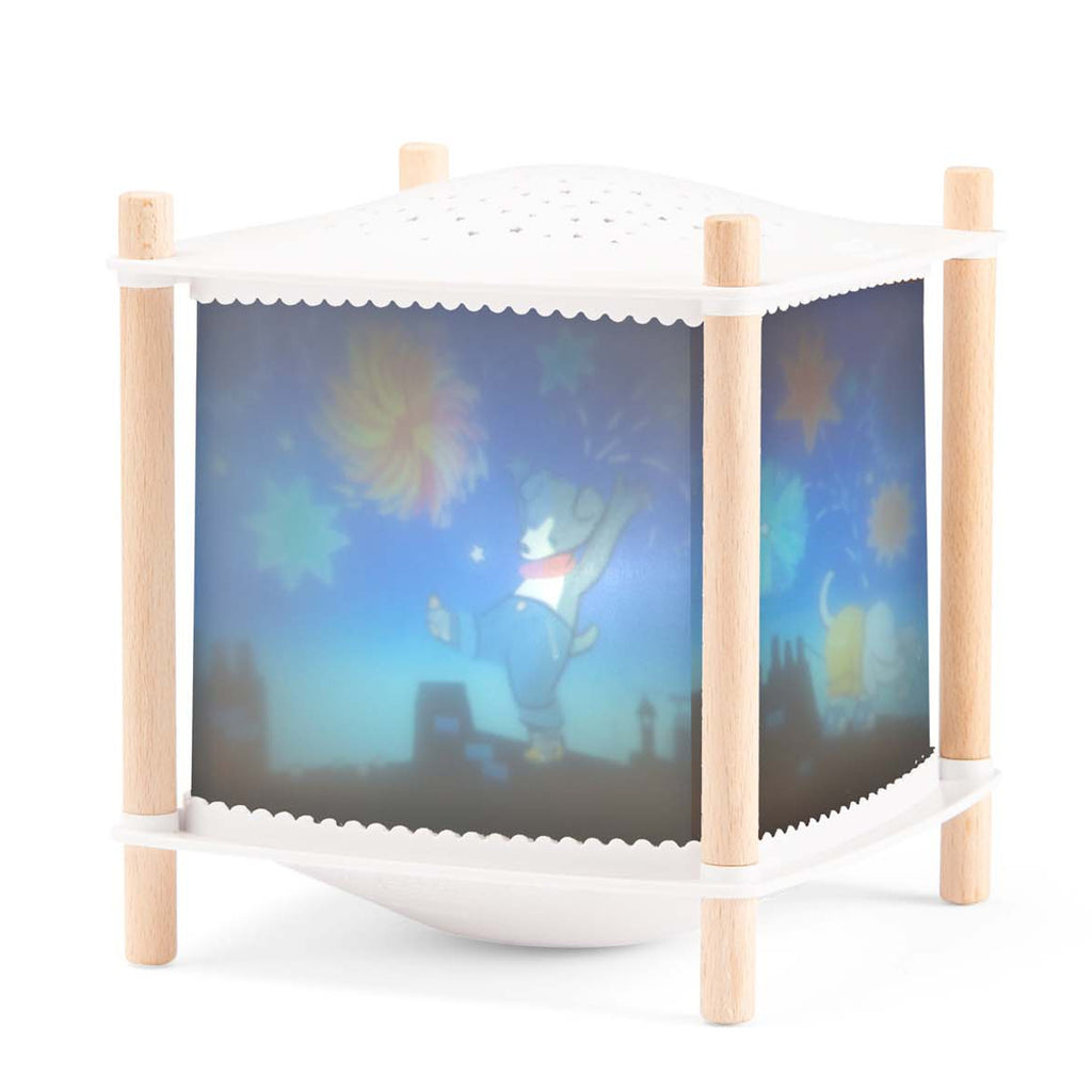 Wooden night lamp projecting colorful images of a bear with fireworks on a blue sky. The lamp has a cute, playful design and a cozy ambiance.