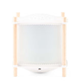 White magic lantern night light with wooden corner posts and starry projector top.