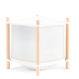 Magic lantern night light for nursery featuring a white frame, starry top, and light wood posts.