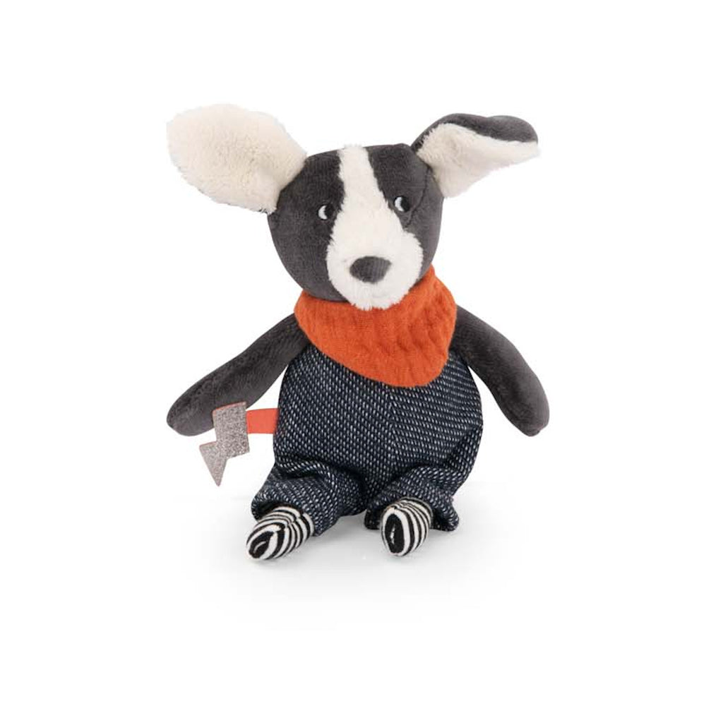 A plush dog toy with dark gray fur, large floppy ears, an orange scarf, and blue pants. It has striped black and white legs, exuding a playful vibe.
