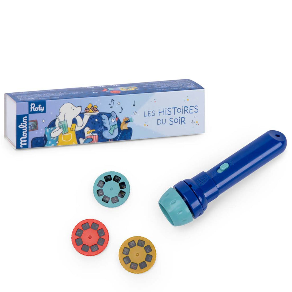 Blue story projector set with three colorful story reels on a white surface. Box features playful illustrations and text "Les Histoires du Soir." Fun and imaginative.