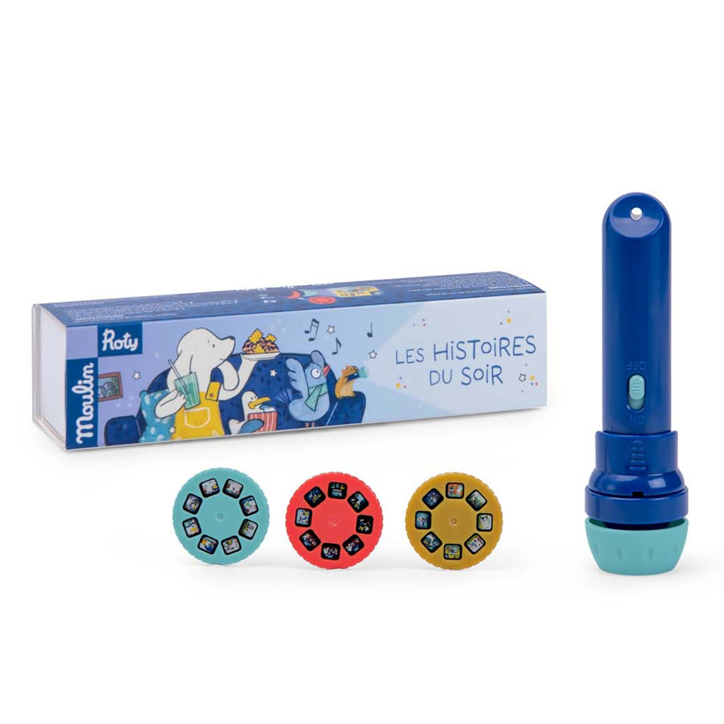 Blue story projector set with three colorful story reels on a white surface. Box features playful illustrations and text "Les Histoires du Soir." Fun and imaginative.