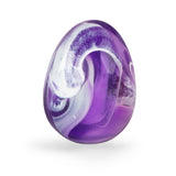 Purple and white swirled glass dragon egg with glossy finish on a clean white background.