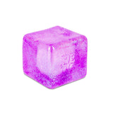 Purple glitter NeeDoh Niceberg glow-in-the-dark stress toy, a squishy translucent ice cube fidget for sensory play.