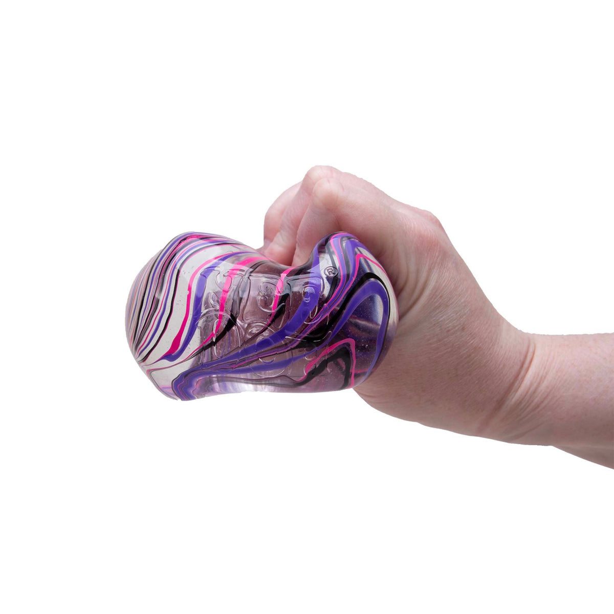 Hand squeezing a NeeDoh Niceberg Swirl squishy stress ball with purple and pink marble patterns on a white background.