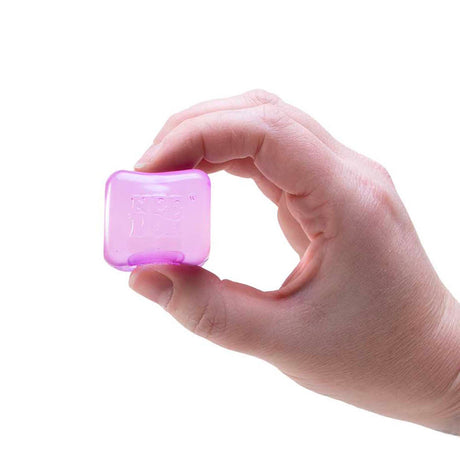 A hand holding a translucent, purple square NeeDoh ice cube stress toy against a white background.